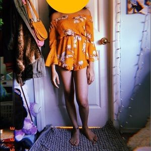 A yellow flowered romper